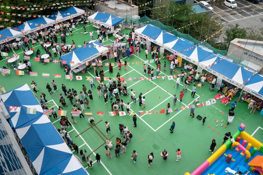 Aerial view of the festival grounds filled with country booths